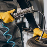 car mechanic changing whels