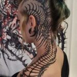 Tattoo artist creating a custom design at a professional tattoo studio Croydon showcasing tattoo ideas for men in London