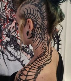 Tattoo artist creating a custom design at a professional tattoo studio Croydon showcasing tattoo ideas for men in London